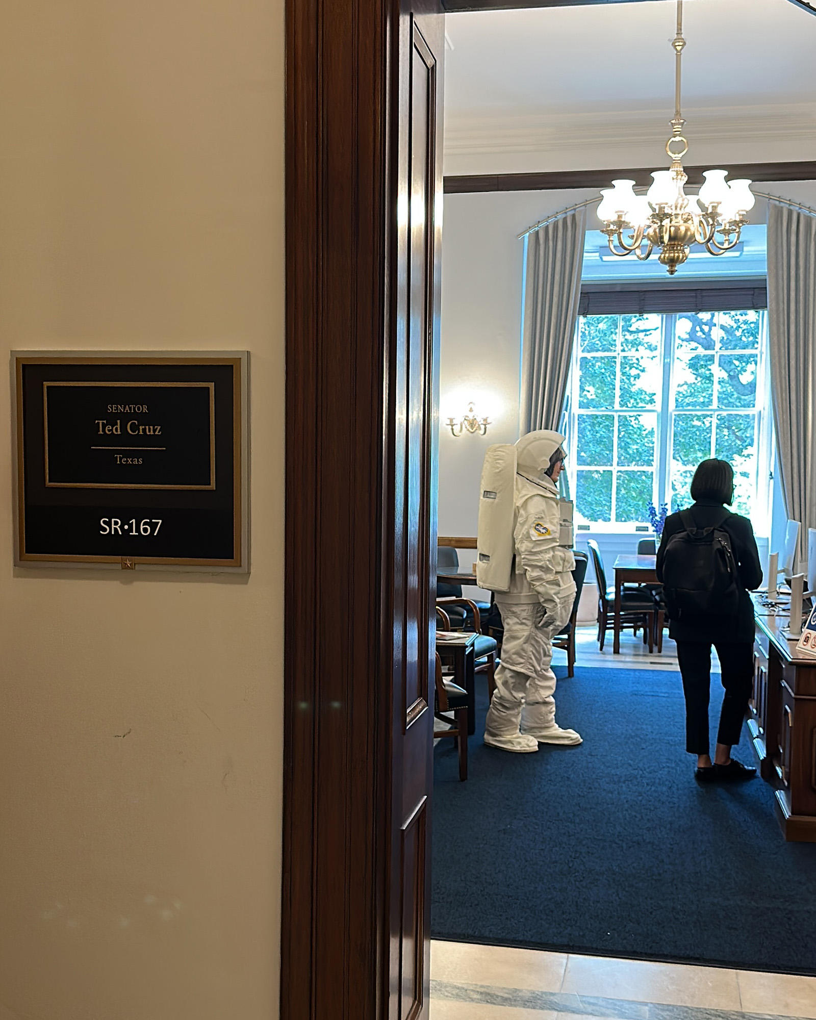 A PSAI campaign partner wears a spacesuit in Congress.